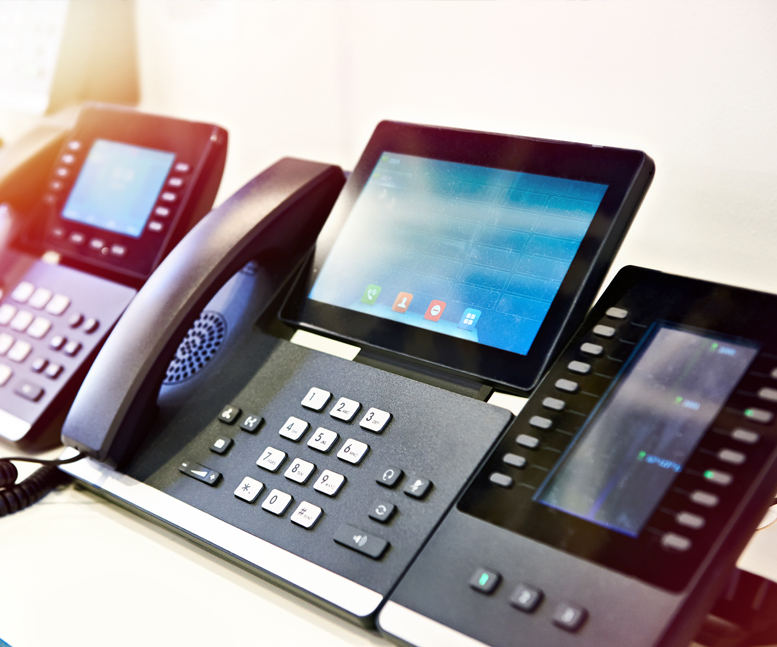 A photo of a Voip phone with a large digital screen